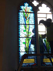 during installation the candles of life memorial stained glass window for michael ashley mann, the queens bishop by john reyntiens